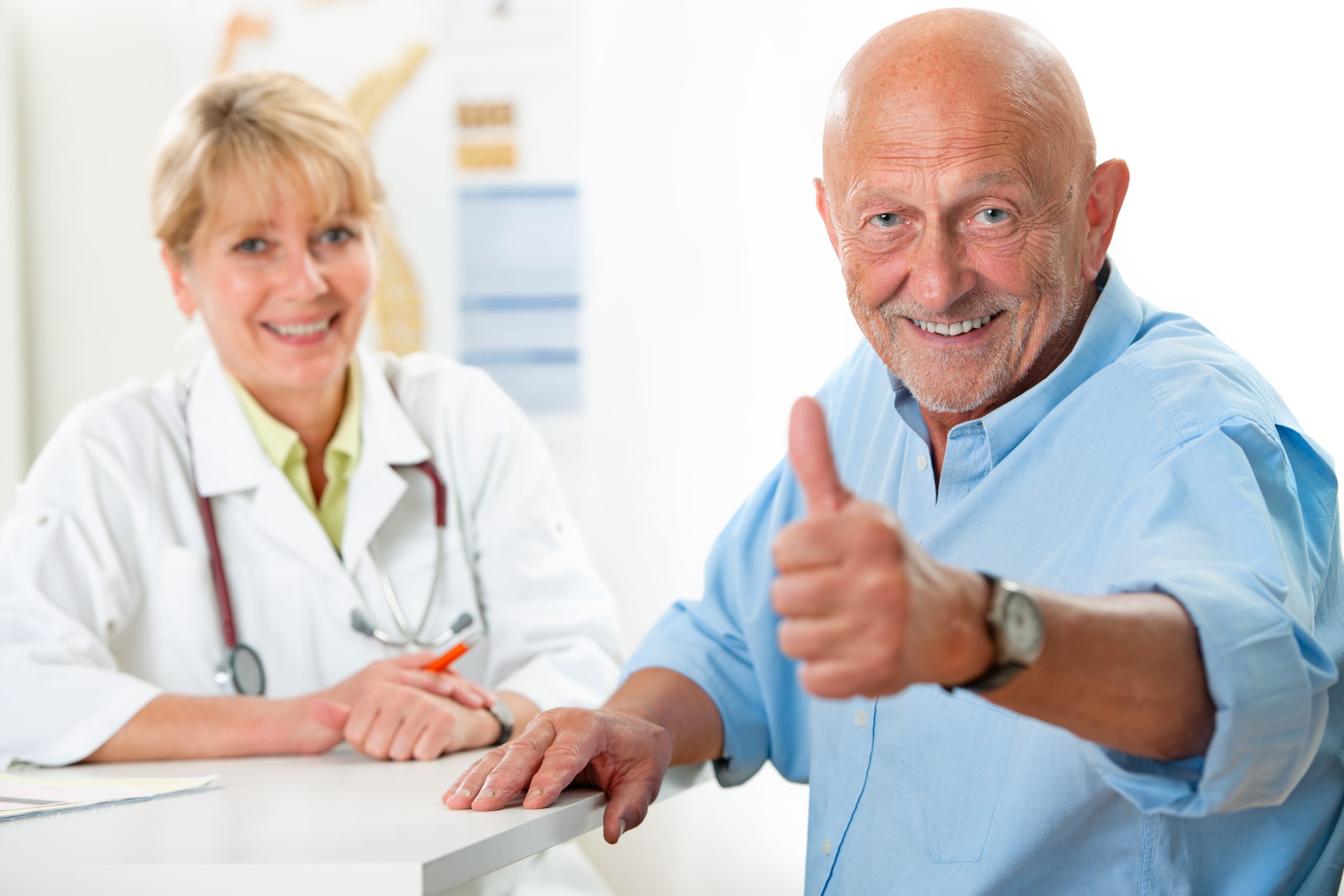 Happy senior patient and doctor at the doctor's office